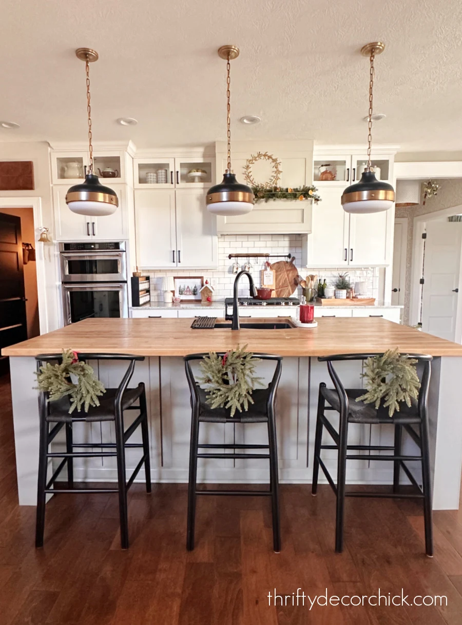 wreaths on kitchen island chairs
